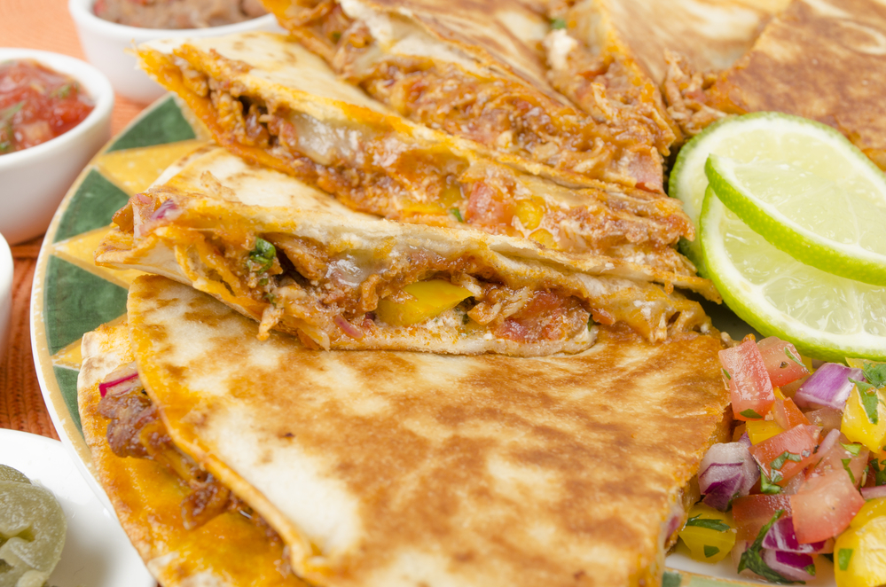 Slices of quesadillas with lime slices