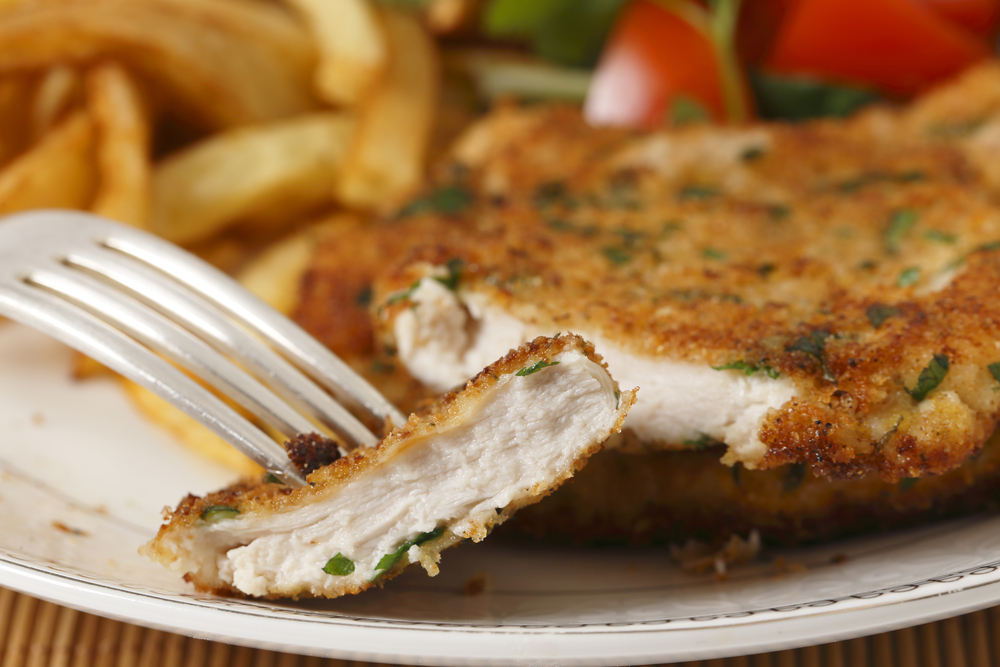Chicken schnitzel sliced closeup - Best restaurants in Hervey Bay