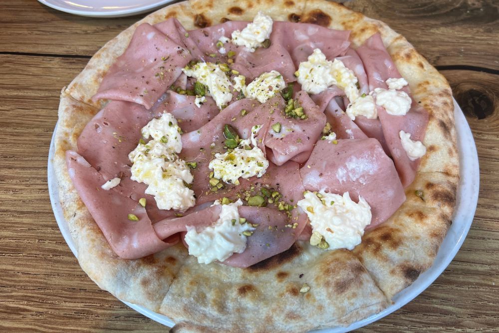 University Cafe Carlton - Mortadella Pizza - Best Restaurants in Port Douglas.